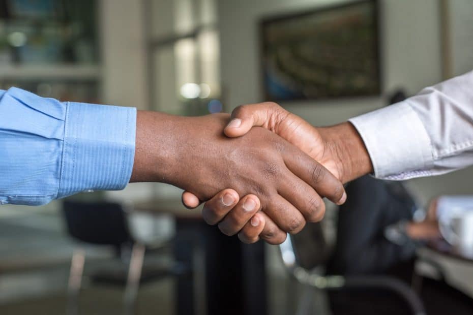 Handshake between a bookkeeper and a client in New Braunfels, TX, symbolizing professional financial.