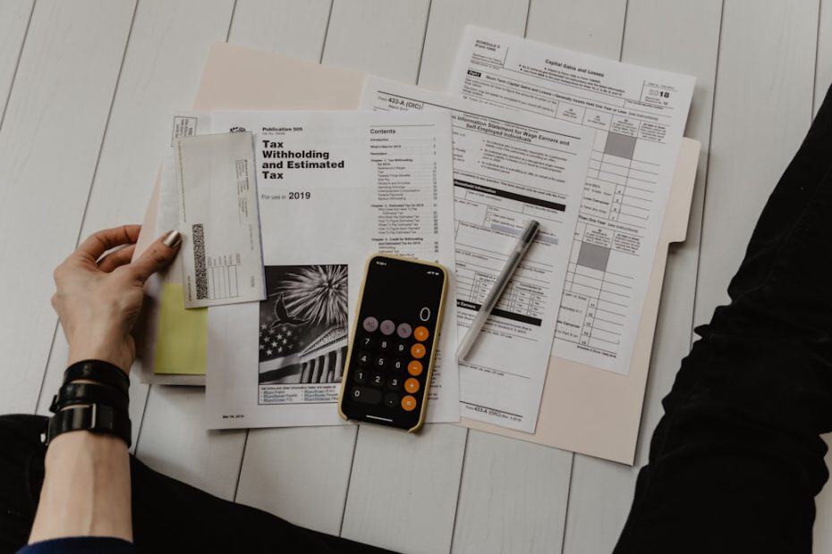 Bookkeeper working on tax documents and financial papers in New Braunfels, TX.